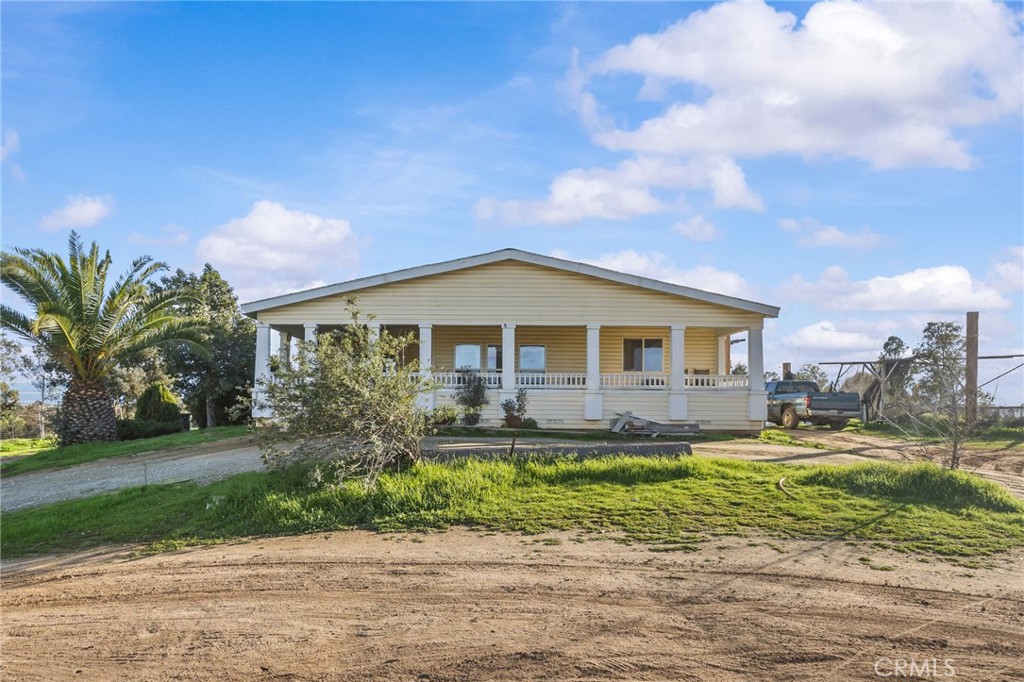 29825 Porth Road Murrieta, CA 92563 - Photo 2 of 40 a front view of a house with a yard