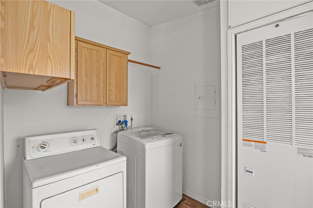 29825 Porth Road Murrieta, CA 92563 - Photo 21 of 40 a view of storage and utility room with washer and dryer