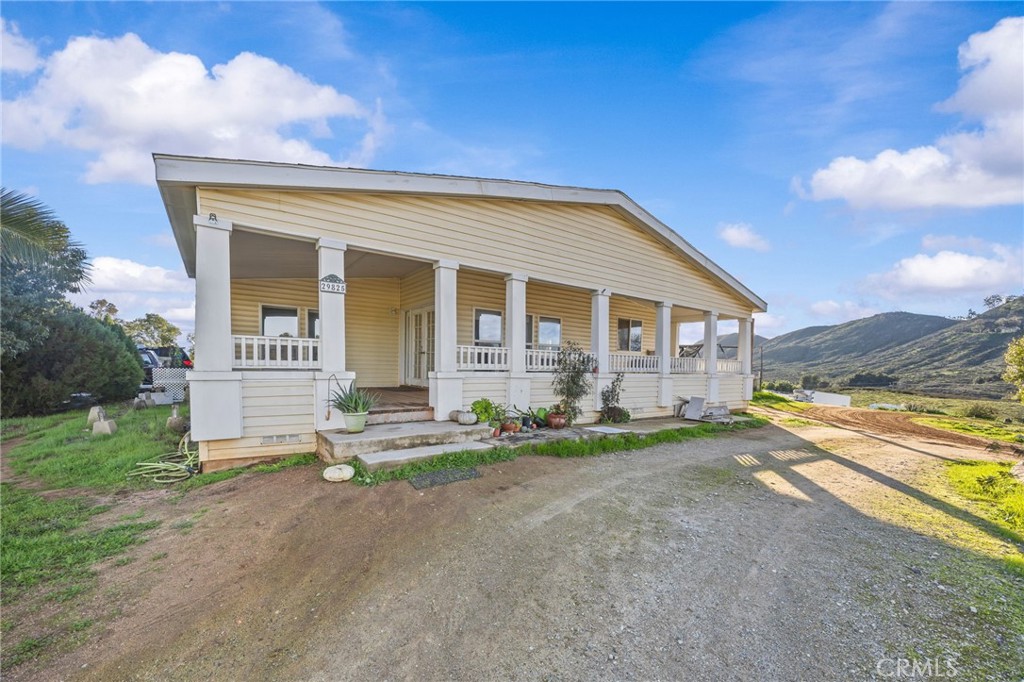 29825 Porth Road Murrieta, CA 92563 - Photo 3 of 40 a front view of a house with a yard