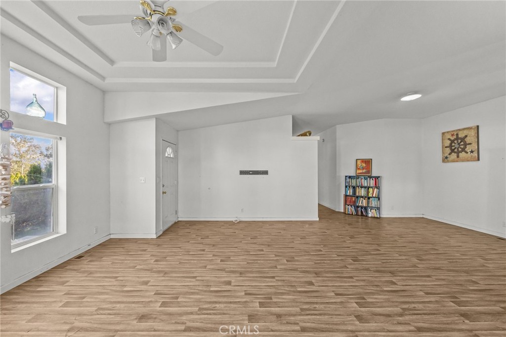 29825 Porth Road Murrieta, CA 92563 - Photo 7 of 40 a view of empty room with wooden floor