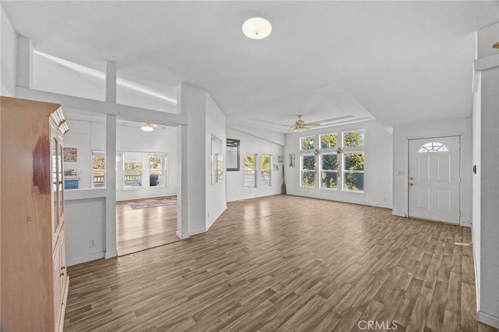 29825 Porth Road Murrieta, CA 92563 - Photo 8 of 40 a view of empty room with wooden floor and windows