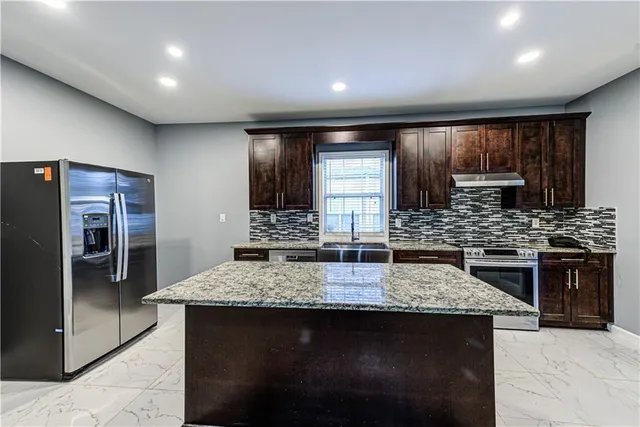 a bathroom with a sink double vanity and a bathtub