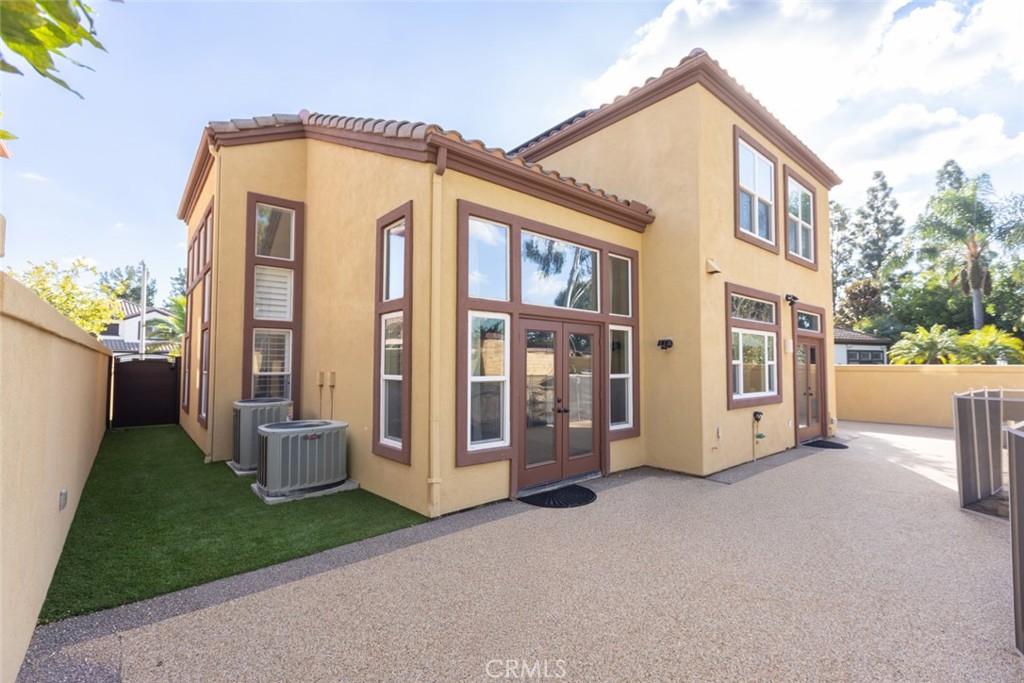 2605 Augusta Tustin, CA 92782 - Photo 20 of 44 a view of a house with many windows and yard