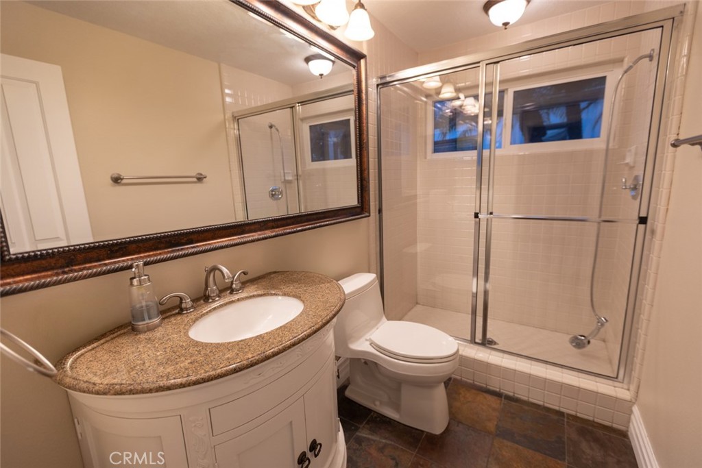2605 Augusta Tustin, CA 92782 - Photo 25 of 44 a bathroom with a sink toilet and shower