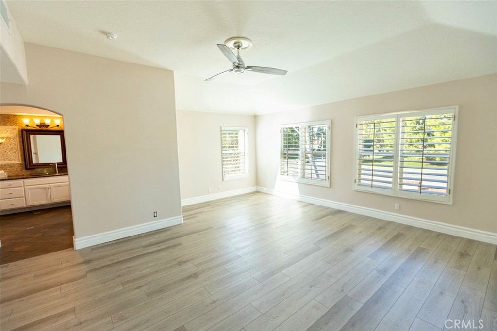 2605 Augusta Tustin, CA 92782 - Photo 28 of 44 a view of an empty room with a window and wooden floor