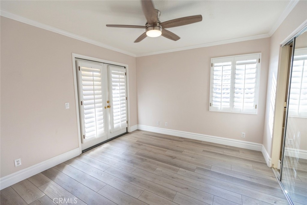 2605 Augusta Tustin, CA 92782 - Photo 33 of 44 a view of an empty room with wooden floor and a window