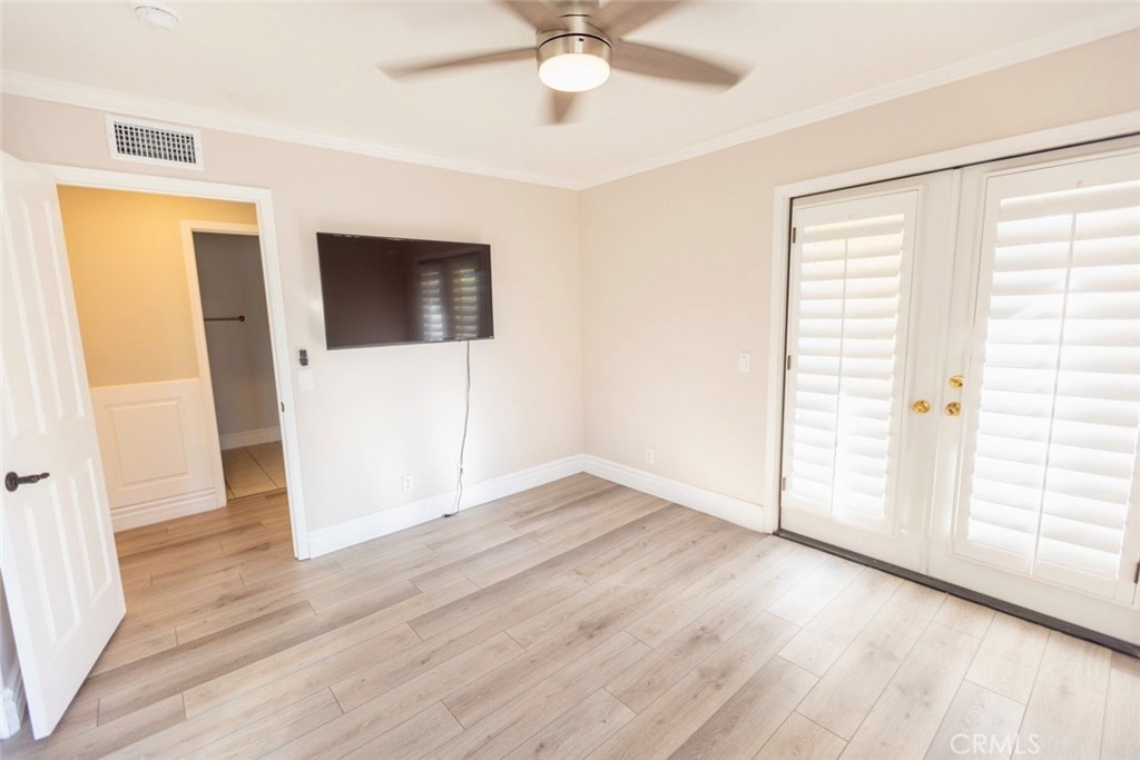 2605 Augusta Tustin, CA 92782 - Photo 35 of 44 an empty room with wooden floor and windows