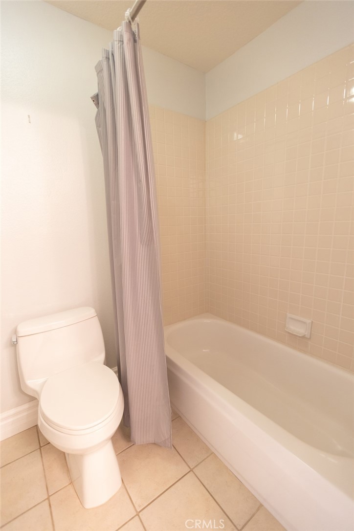2605 Augusta Tustin, CA 92782 - Photo 39 of 44 a white toilet sitting next to a bath tub