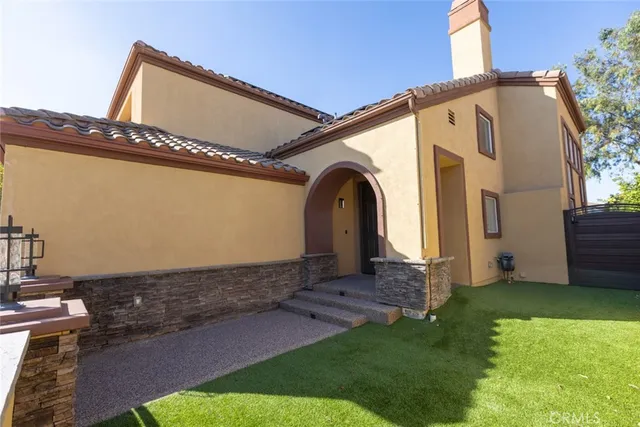 a view of front door and small yard