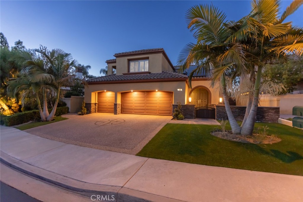 2605 Augusta Tustin, CA 92782 - Photo 44 of 44 a front view of a house with a yard and a garage
