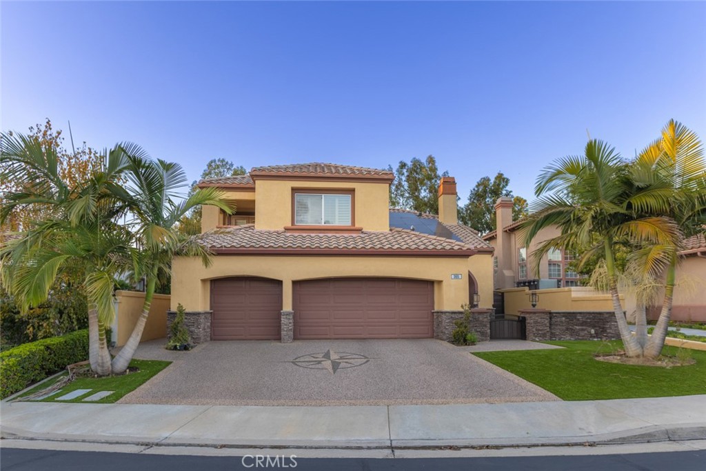 2605 Augusta Tustin, CA 92782 - Photo 44 of 44 a front view of a house with a yard and garage
