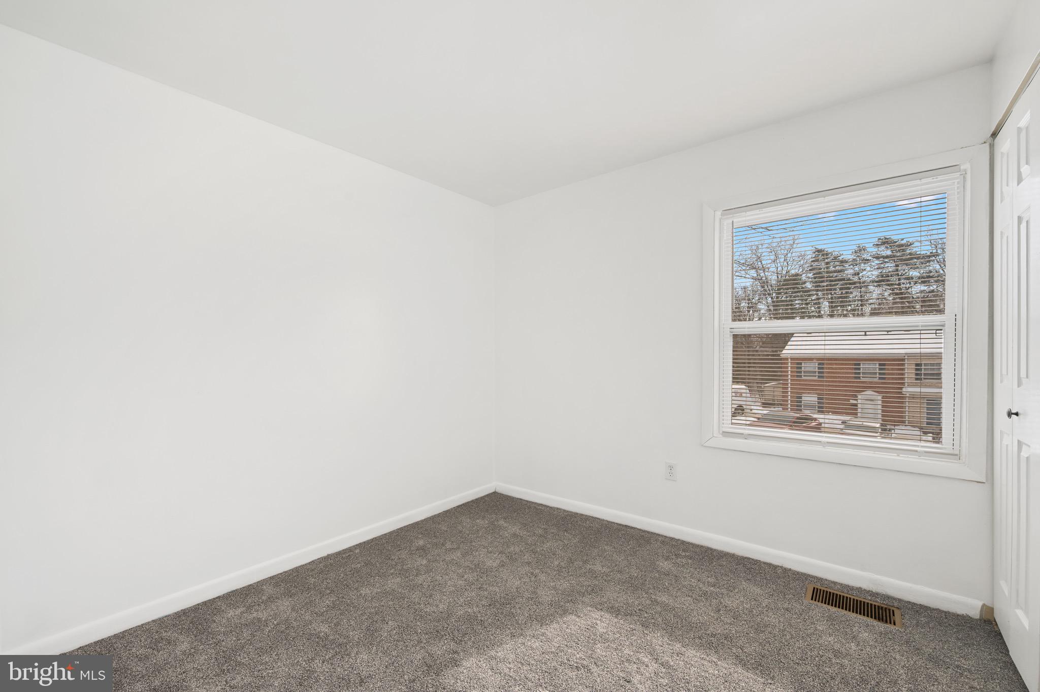 9640 Homestead Court, Unit F Laurel, MD 20723 - Photo 11 of 14 an empty room with a window