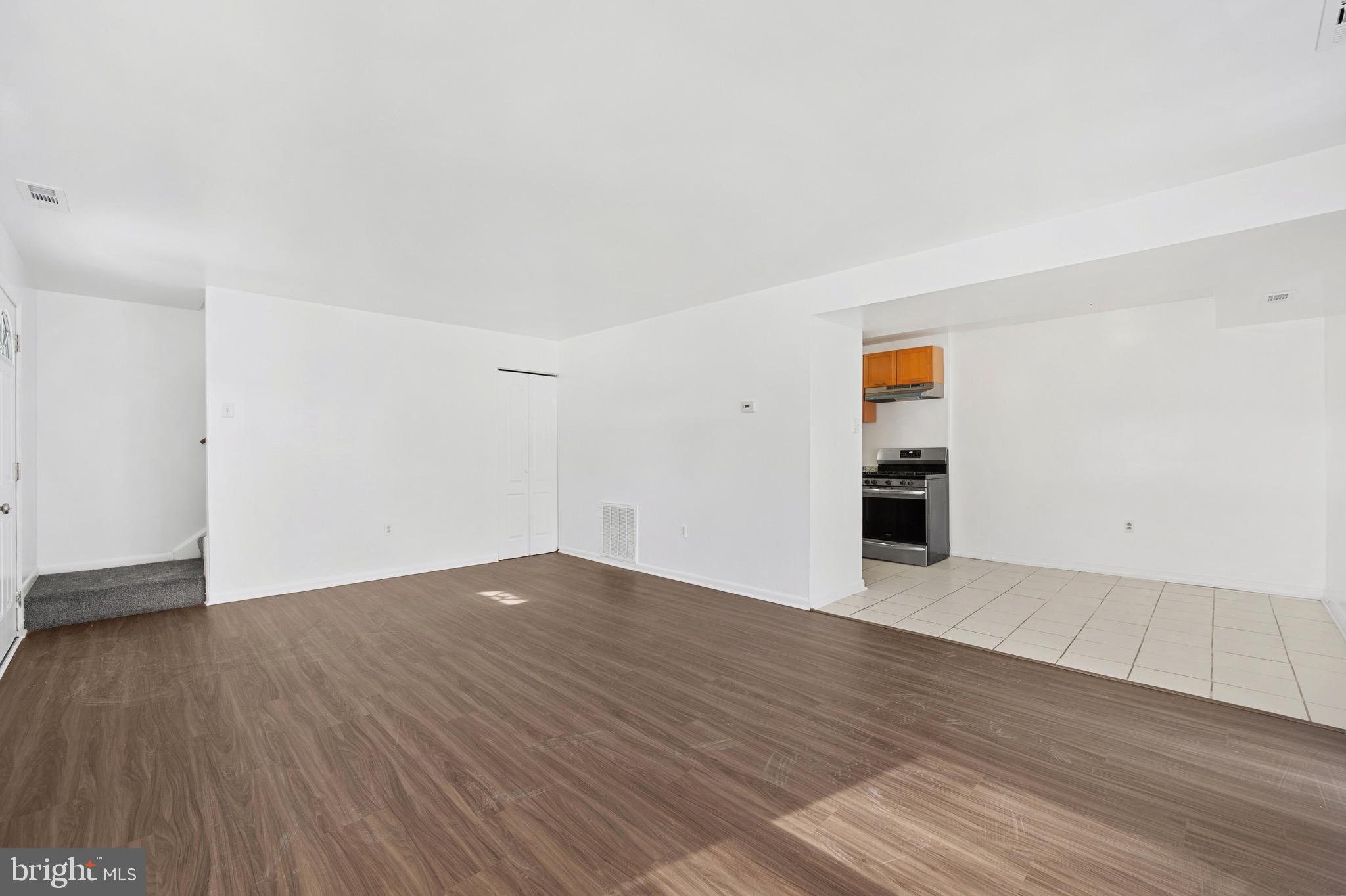 9640 Homestead Court, Unit F Laurel, MD 20723 - Photo 4 of 14 an empty room with wooden floor