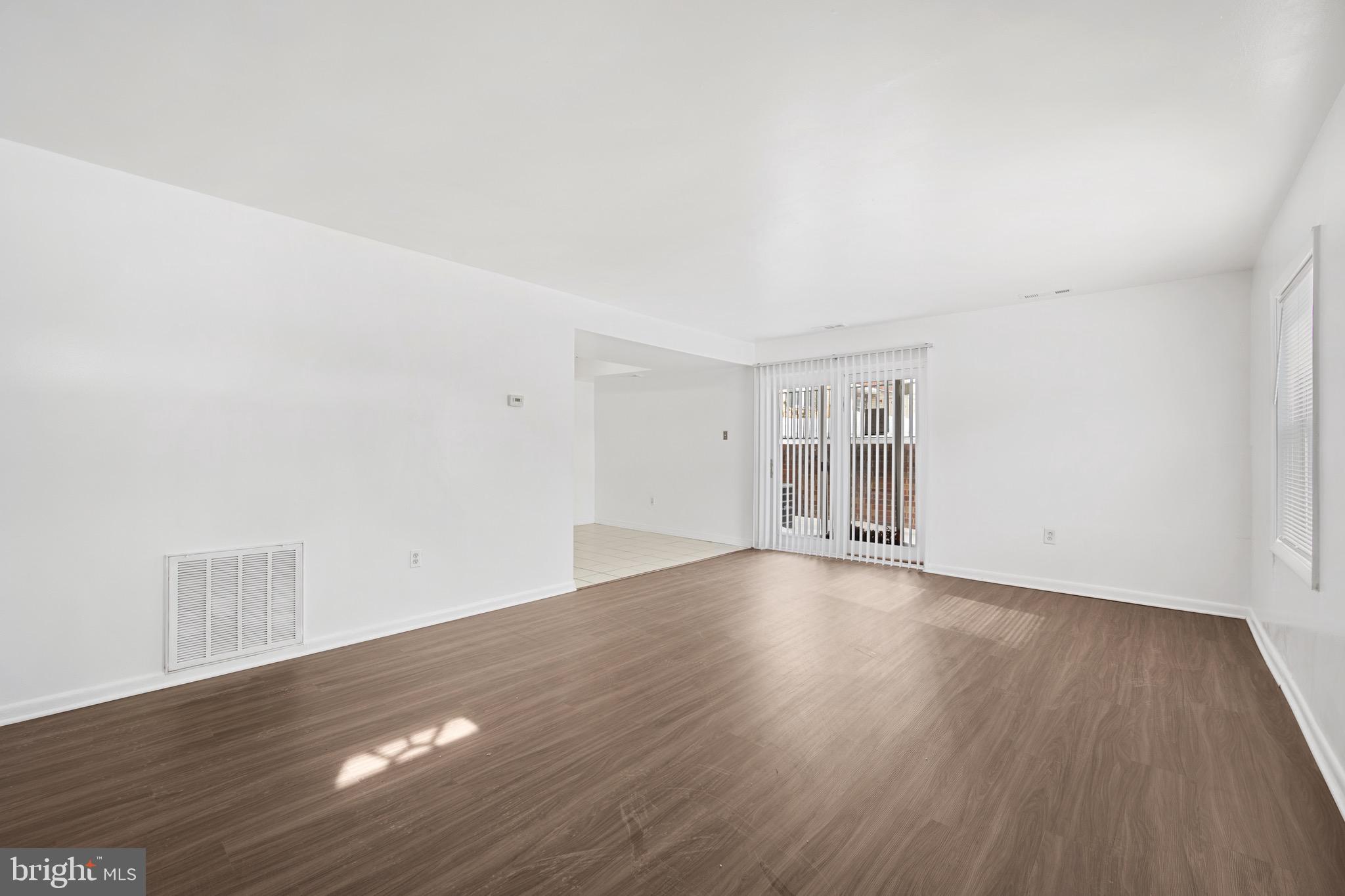 9640 Homestead Court, Unit F Laurel, MD 20723 - Photo 5 of 14 a view of an empty room and wooden floor