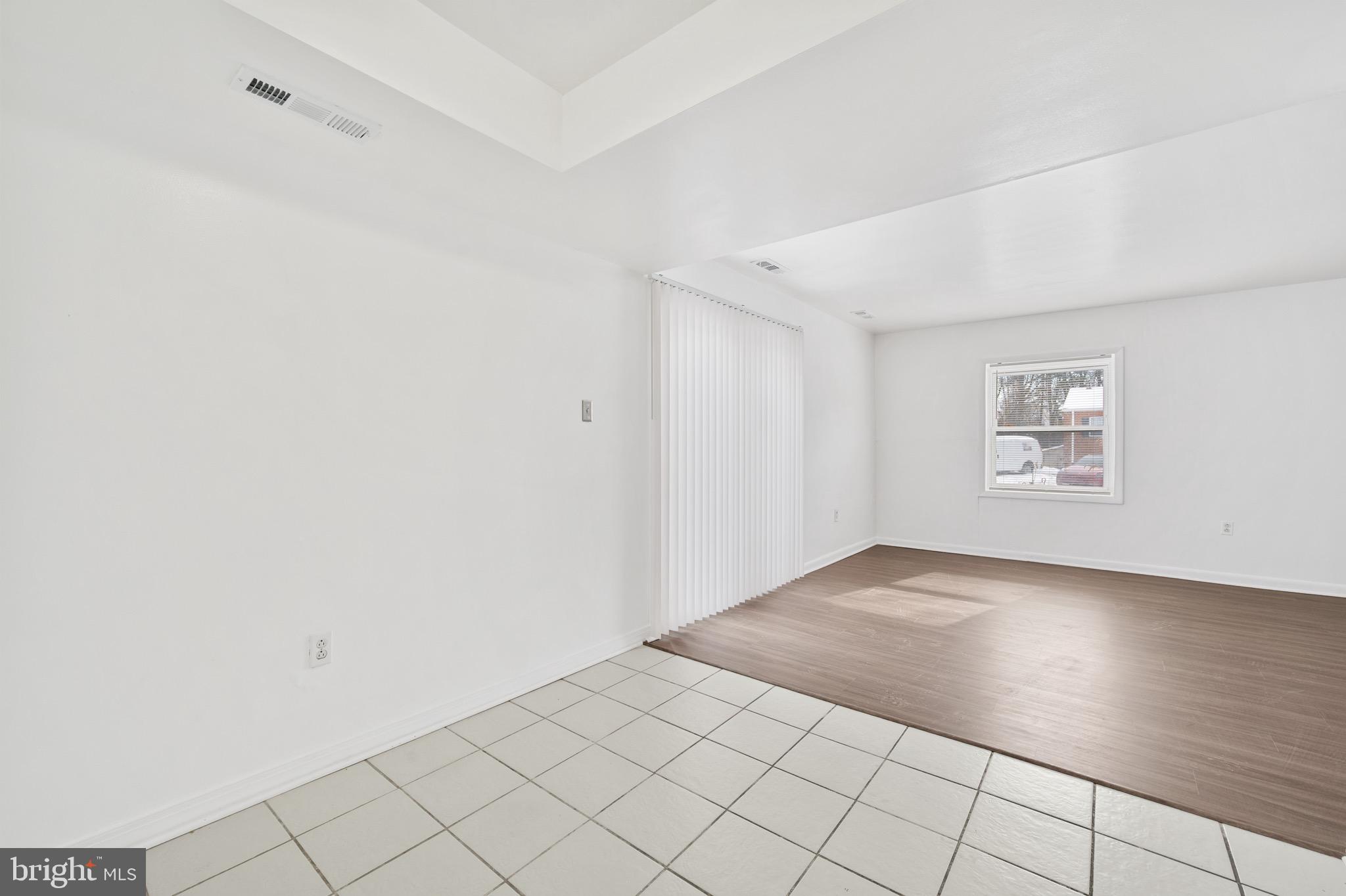 9640 Homestead Court, Unit F Laurel, MD 20723 - Photo 9 of 14 an empty room with windows
