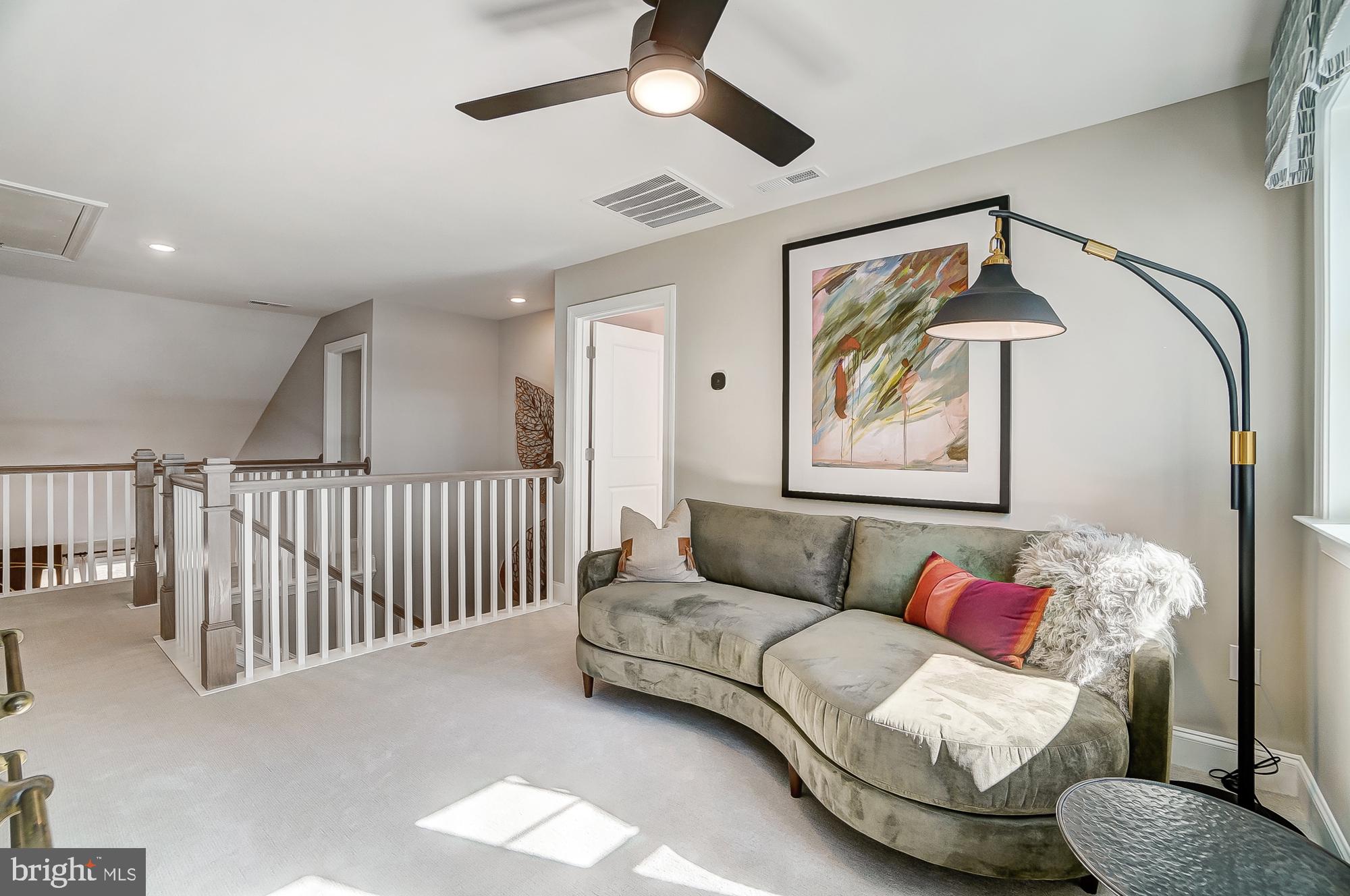 14925 Abelia Court Issue, MD 20645 - Photo 19 of 42 a living room with furniture and a ceiling fan