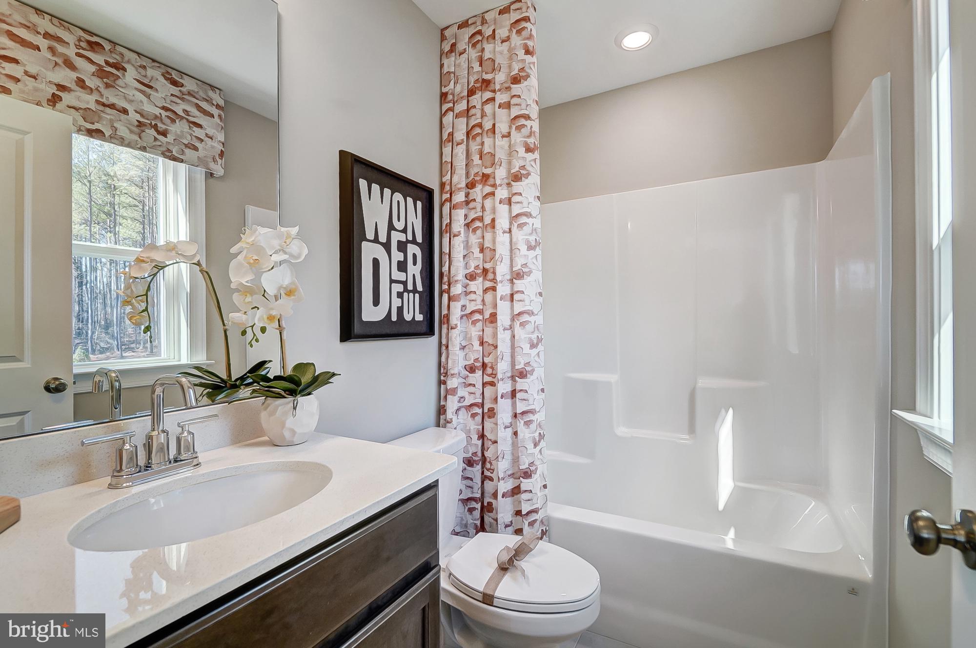 14925 Abelia Court Issue, MD 20645 - Photo 22 of 42 a bathroom with a sink toilet and shower