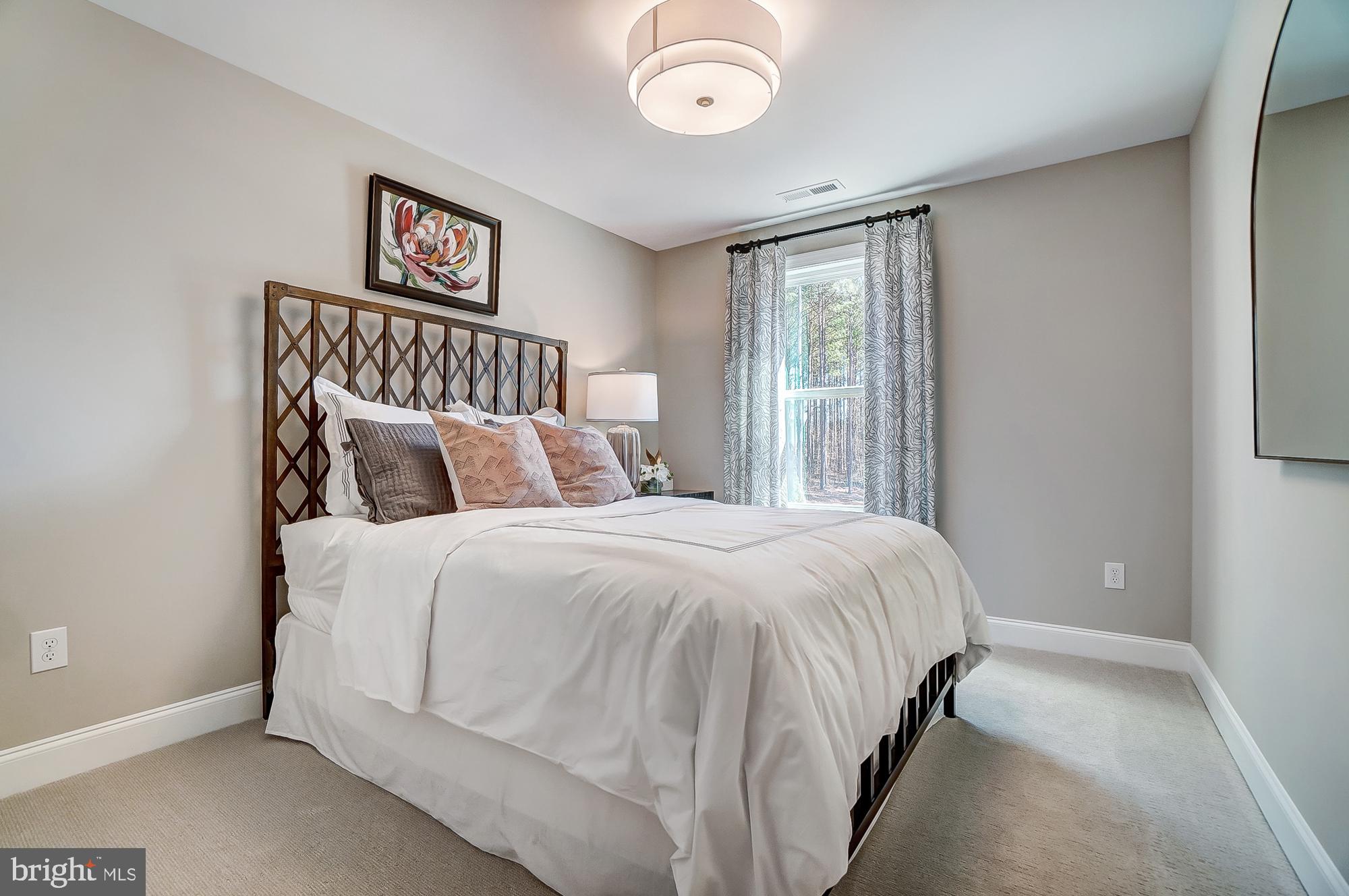 14925 Abelia Court Issue, MD 20645 - Photo 23 of 42 a bedroom with a bed and a window