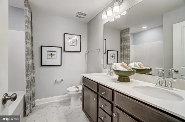 a bedroom with a bed and cabinet