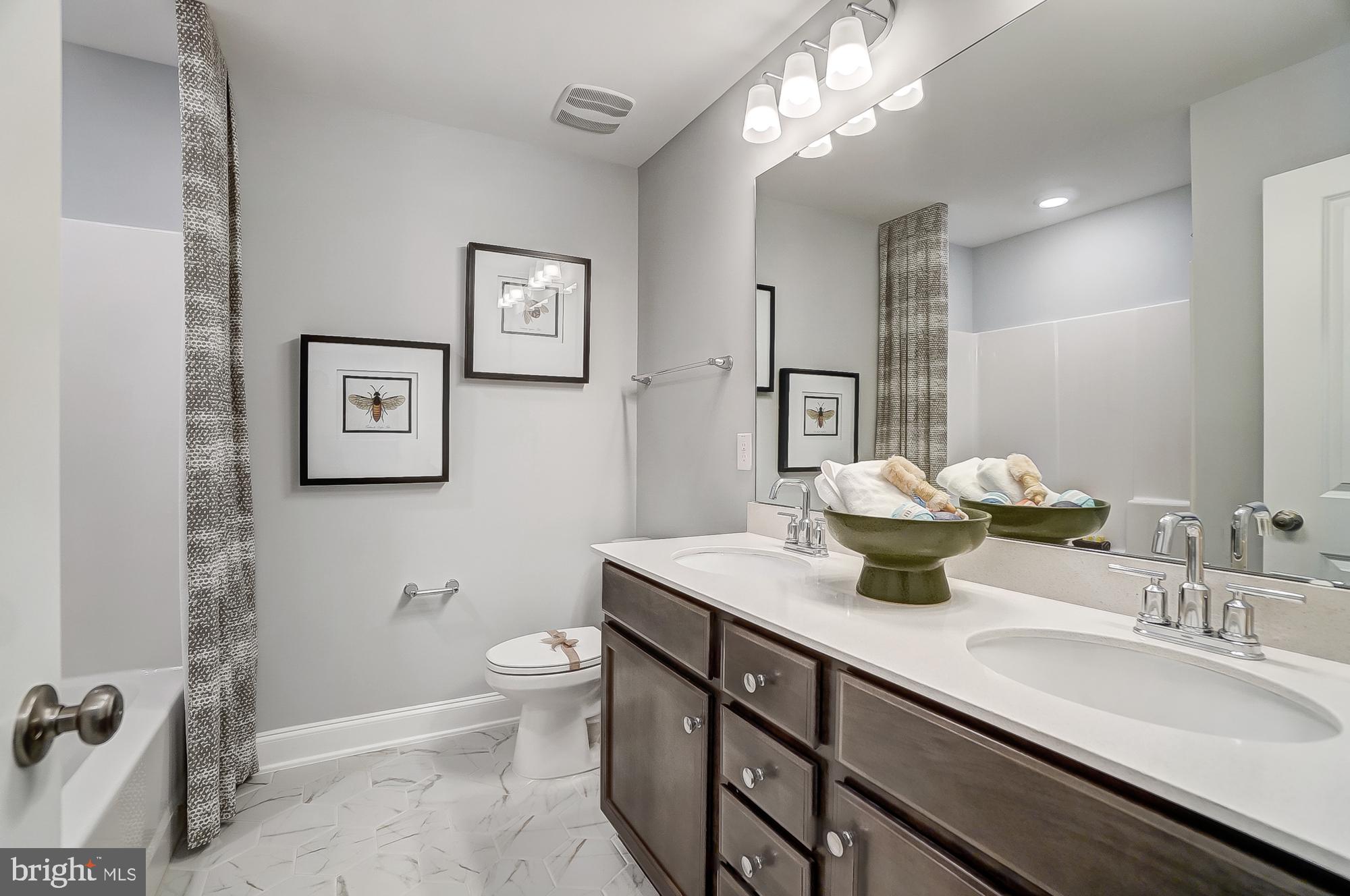 14925 Abelia Court Issue, MD 20645 - Photo 24 of 42 a bathroom with a sink a toilet and a mirror