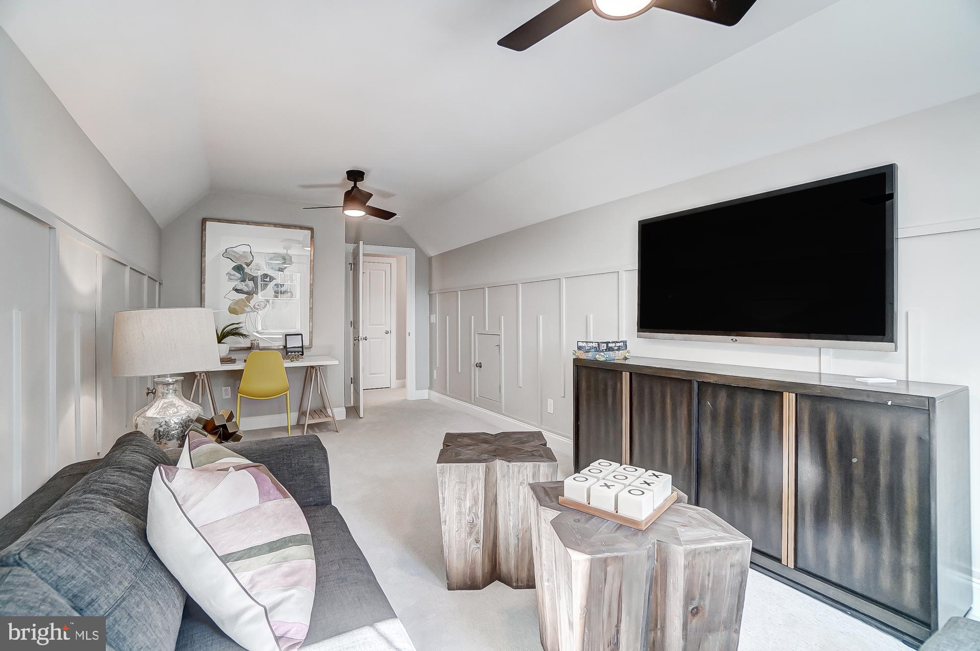14925 Abelia Court Issue, MD 20645 - Photo 27 of 42 a living room with furniture and a flat screen tv