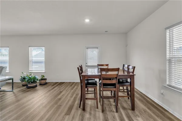 a bathroom with a granite countertop toilet and a shower