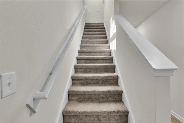 a bathroom with a tub a mirror and a sink