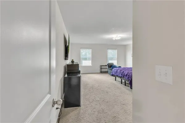 a bed room with a bed and a desk