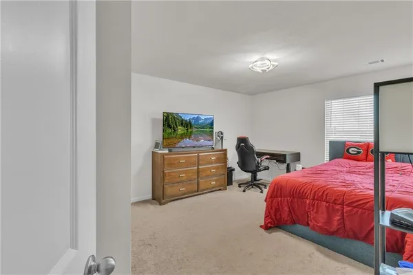 a view of a patio with table and chairs