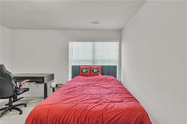 a view of a house with pool and chairs