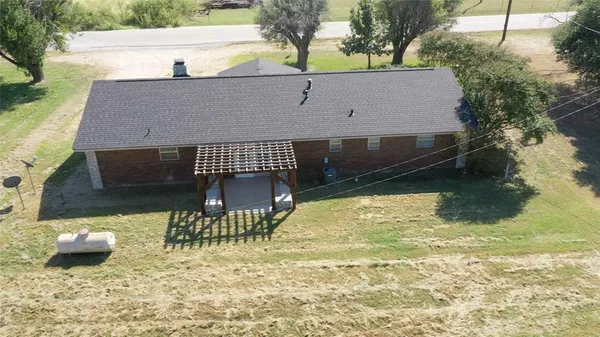 a view of swimming pool with a patio and a yard