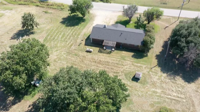 a view of a backyard of the house