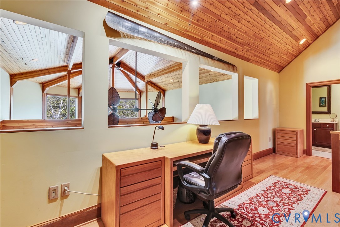176 Baypointe Court Reedville, VA 22539 - Photo 43 of 60 a view of a workspace with furniture and a window