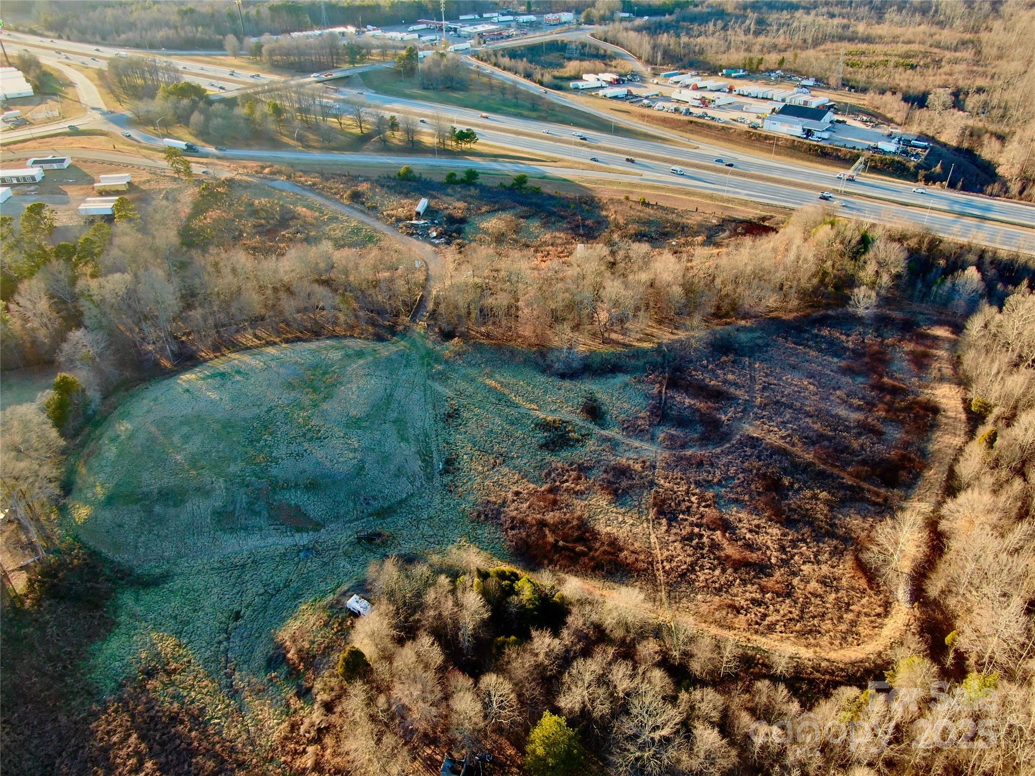 1140 Peeler Road Salisbury, NC 28146 - Photo 6 of 6 a view of a garden with a pathway