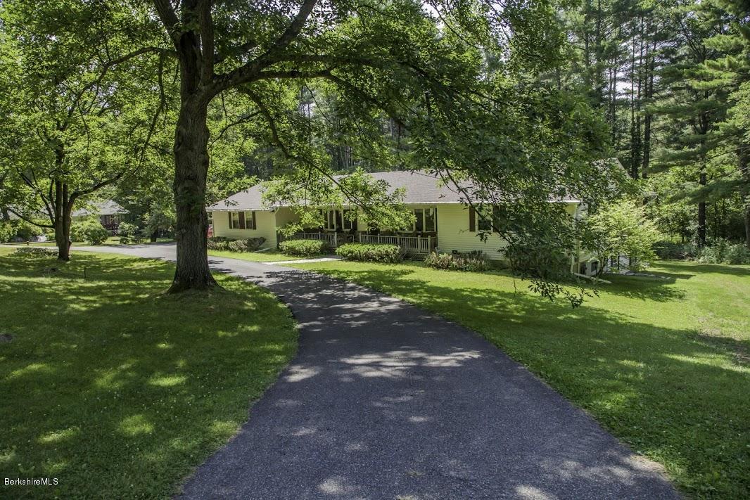 375 Devon Road Lee, MA 01238 - Photo 1 of 23 a front view of a house with a yard