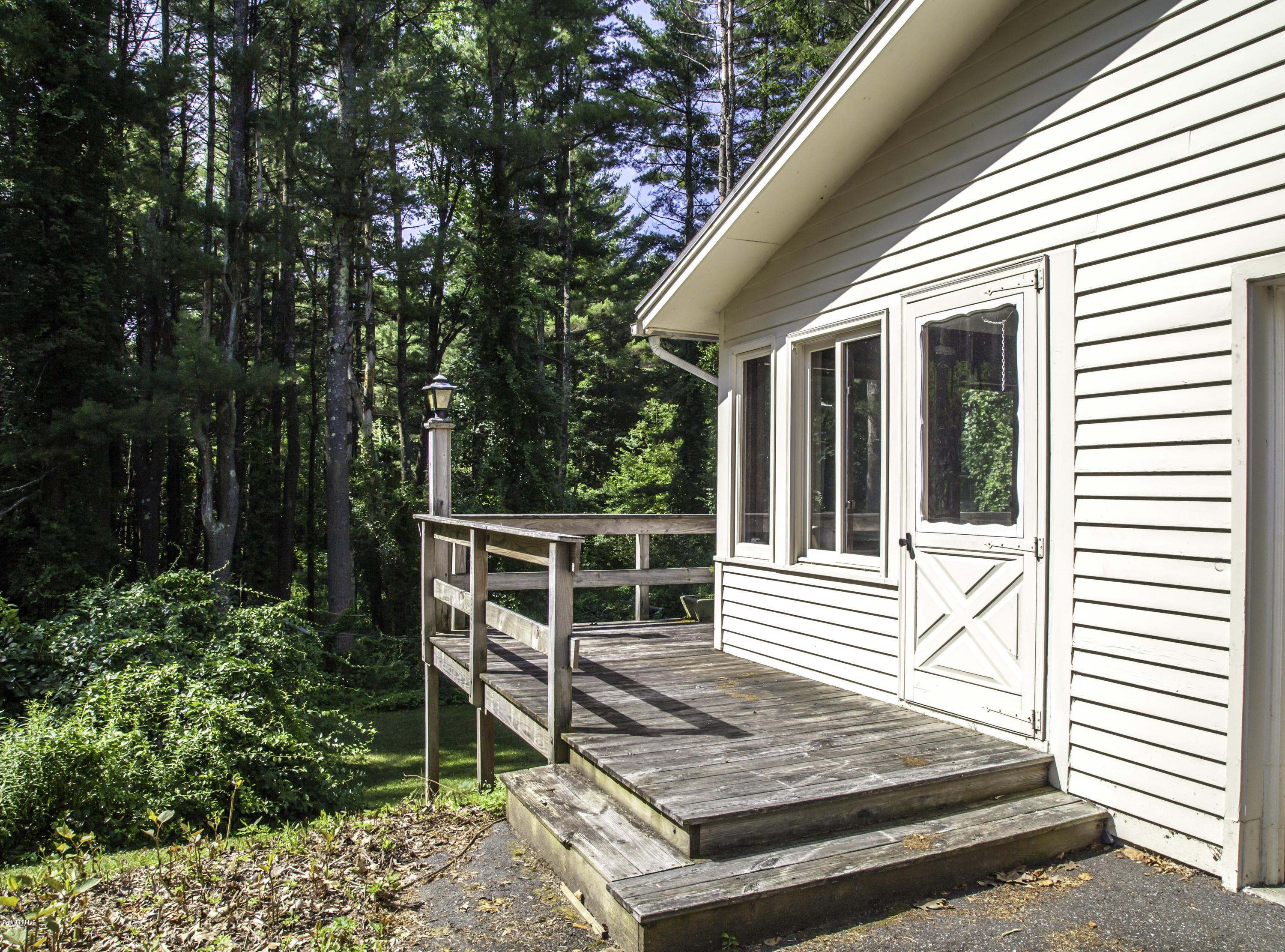 375 Devon Road Lee, MA 01238 - Photo 20 of 23 a house with trees in front of it