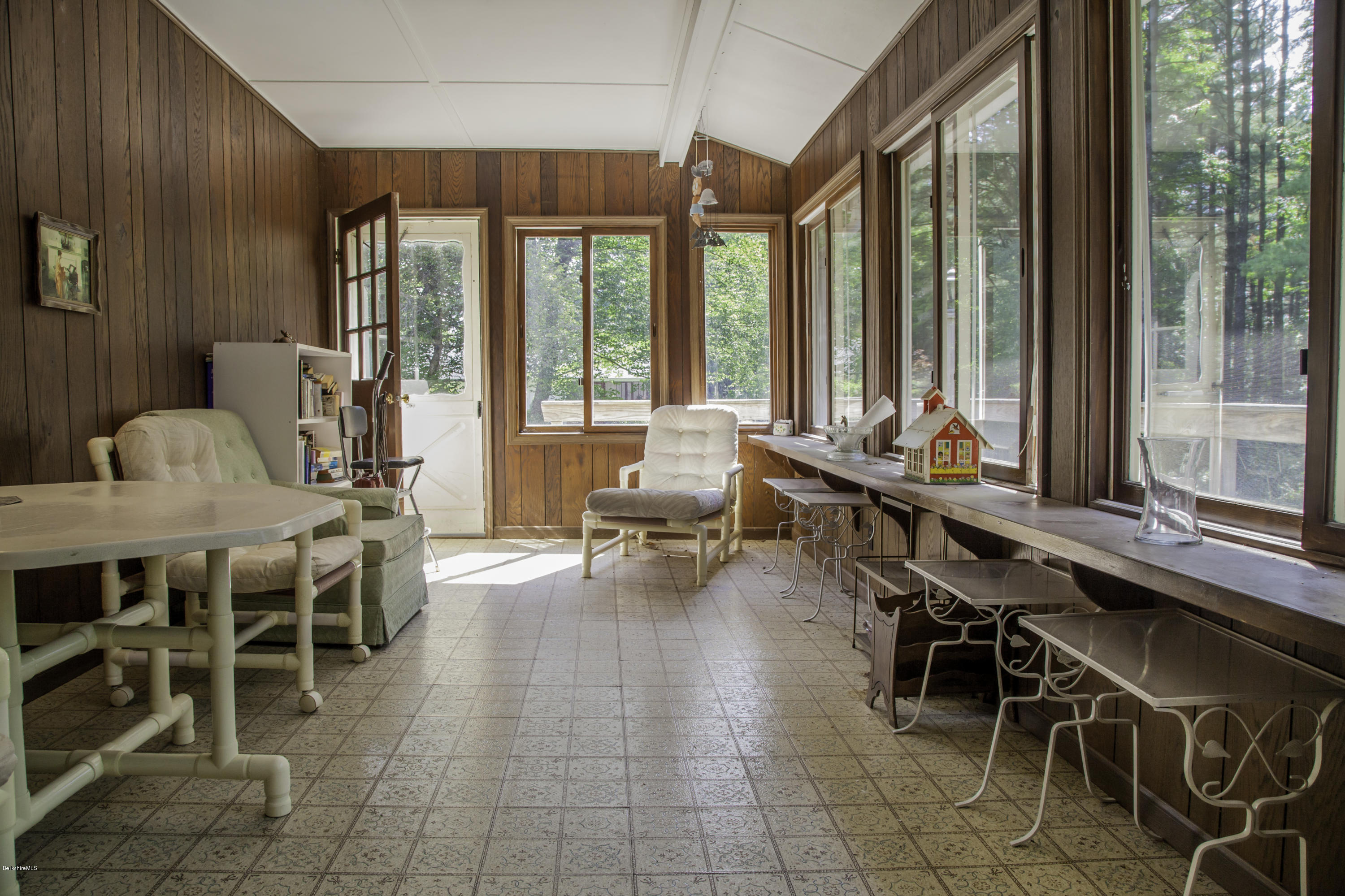 375 Devon Road Lee, MA 01238 - Photo 21 of 23 a room with lots of wooden furniture and a large window