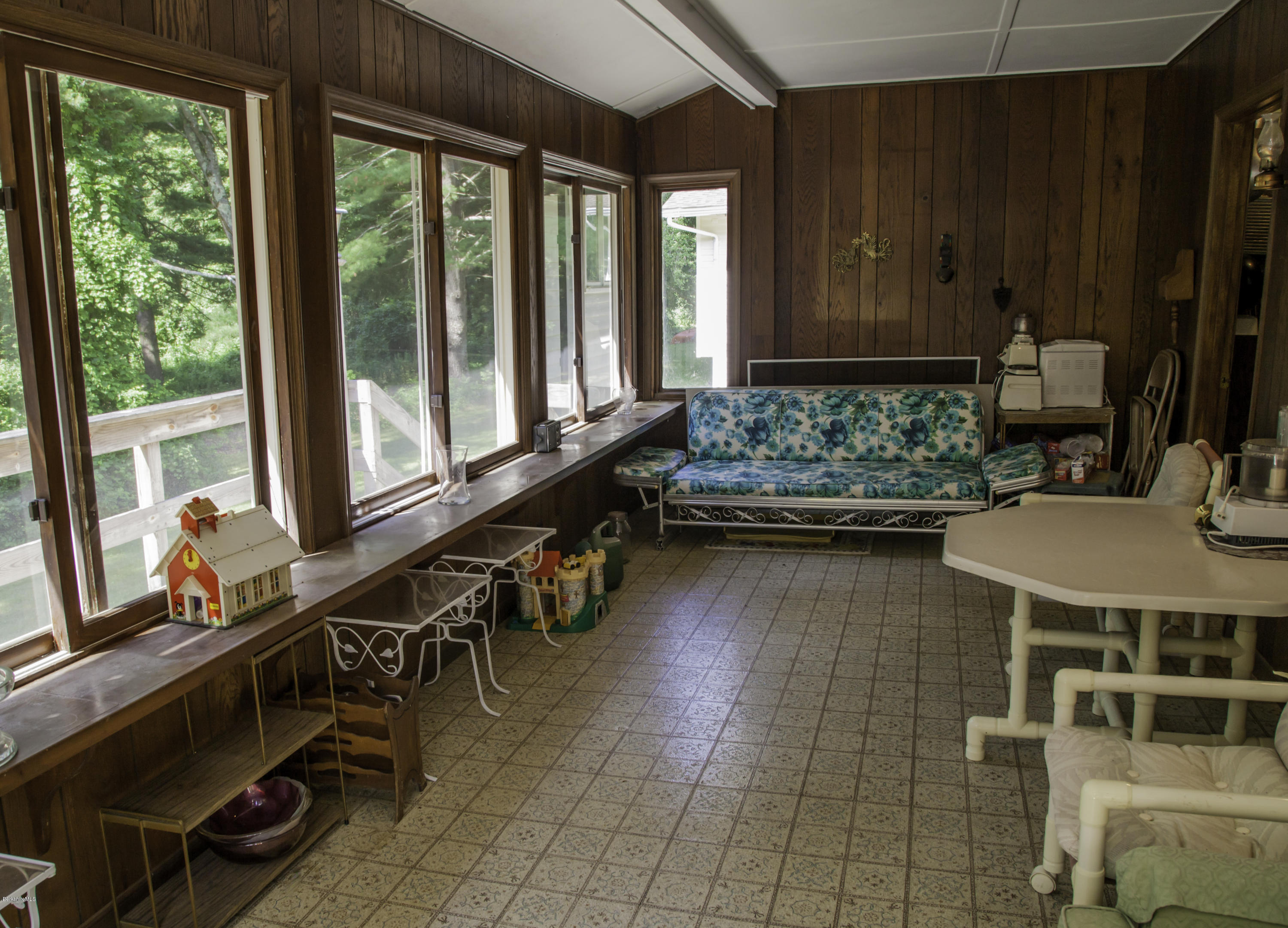 375 Devon Road Lee, MA 01238 - Photo 22 of 23 a room with lots of potted plants and large windows