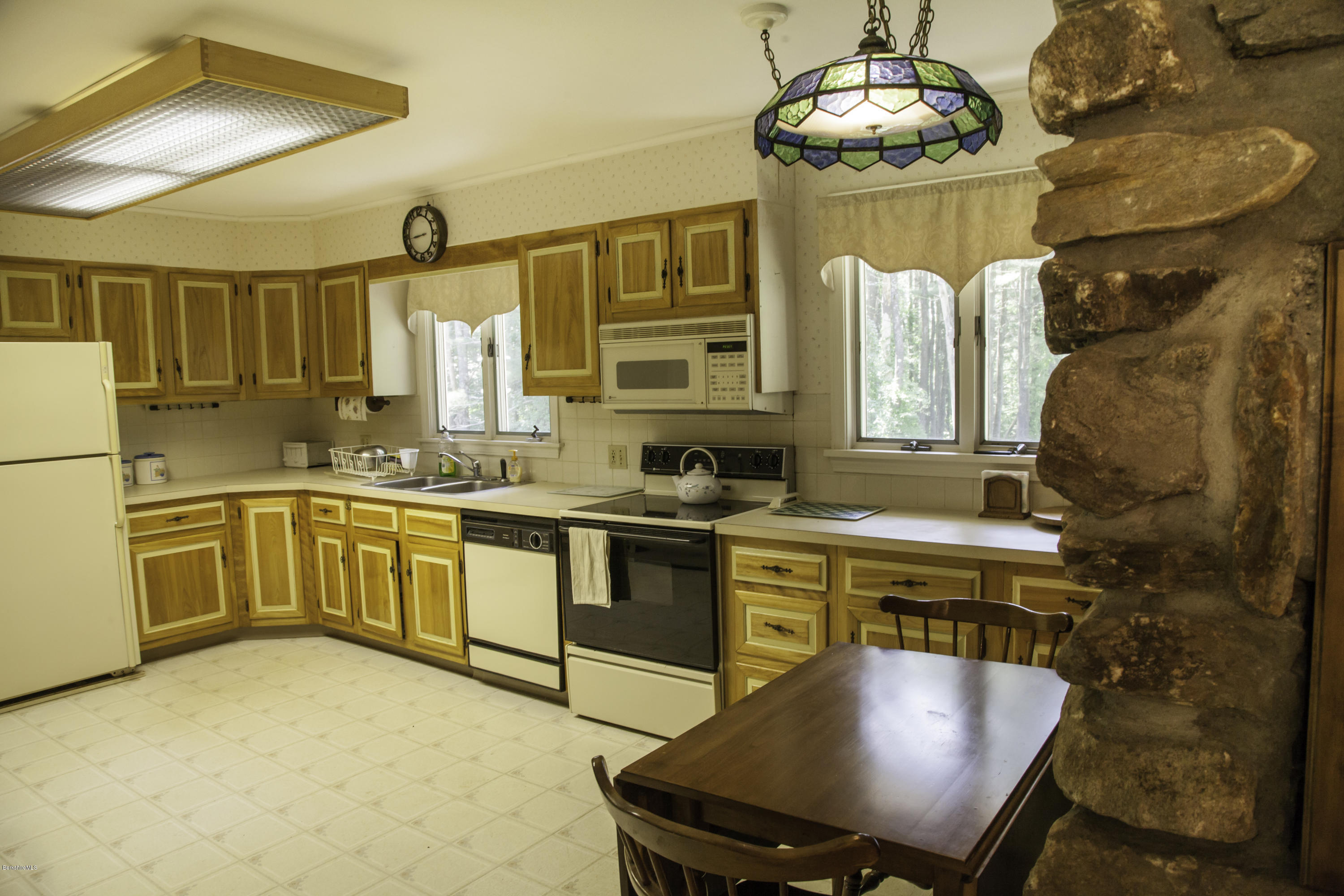 375 Devon Road Lee, MA 01238 - Photo 6 of 23 a kitchen with a stove a sink and a refrigerator