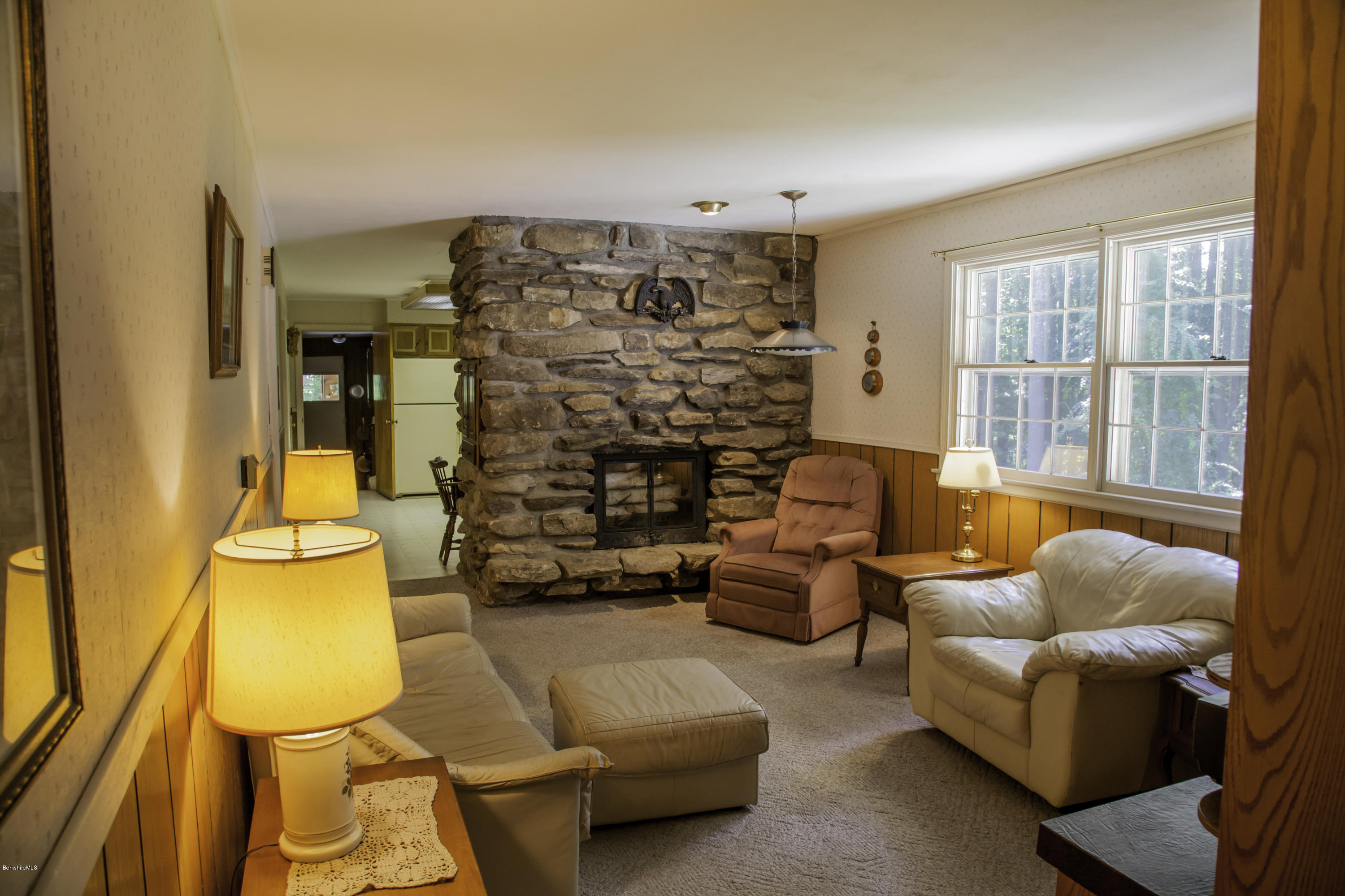 375 Devon Road Lee, MA 01238 - Photo 8 of 23 a living room with furniture a couch and a chandelier