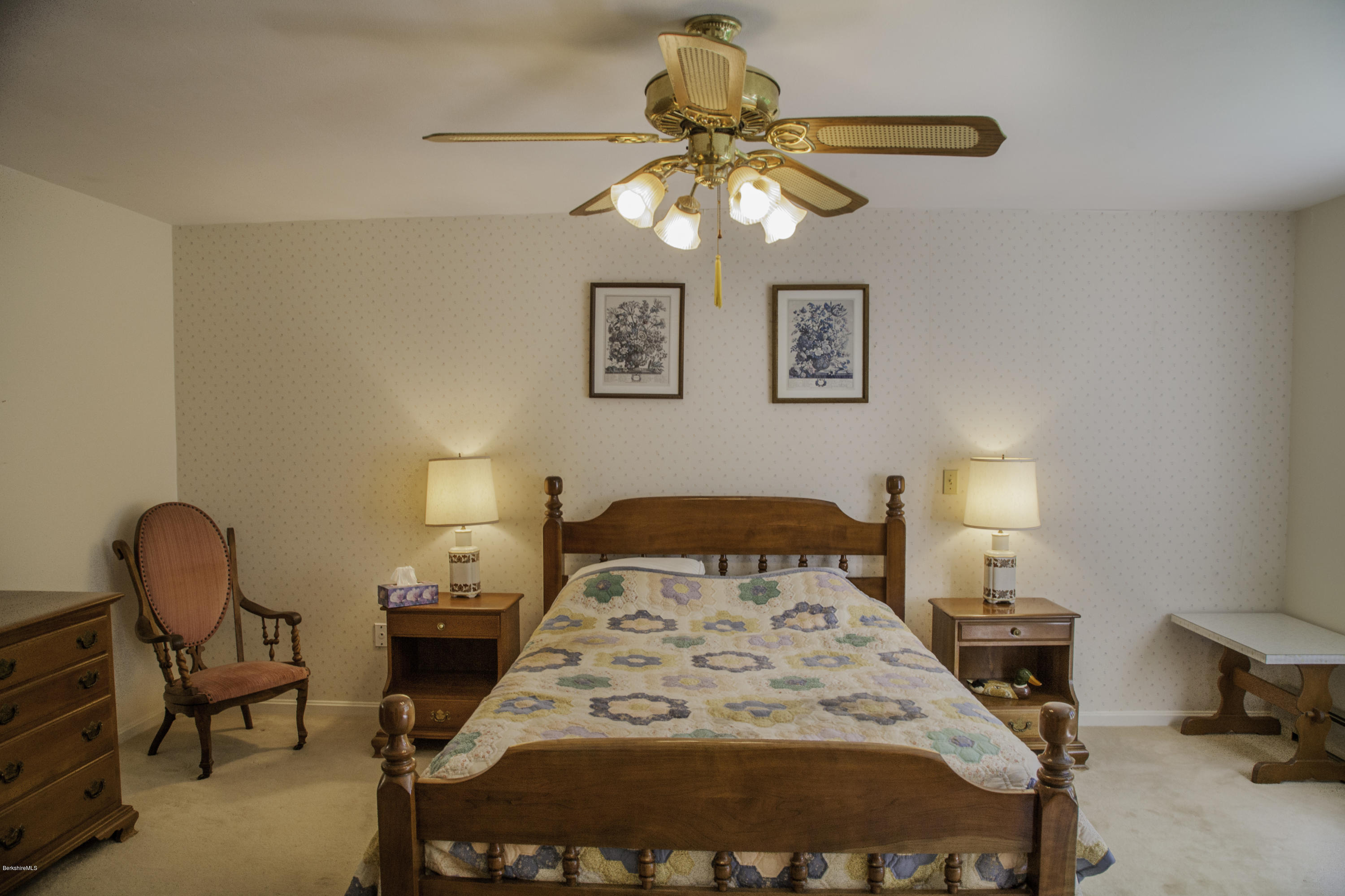 375 Devon Road Lee, MA 01238 - Photo 10 of 23 a bedroom with a bed and a chandelier
