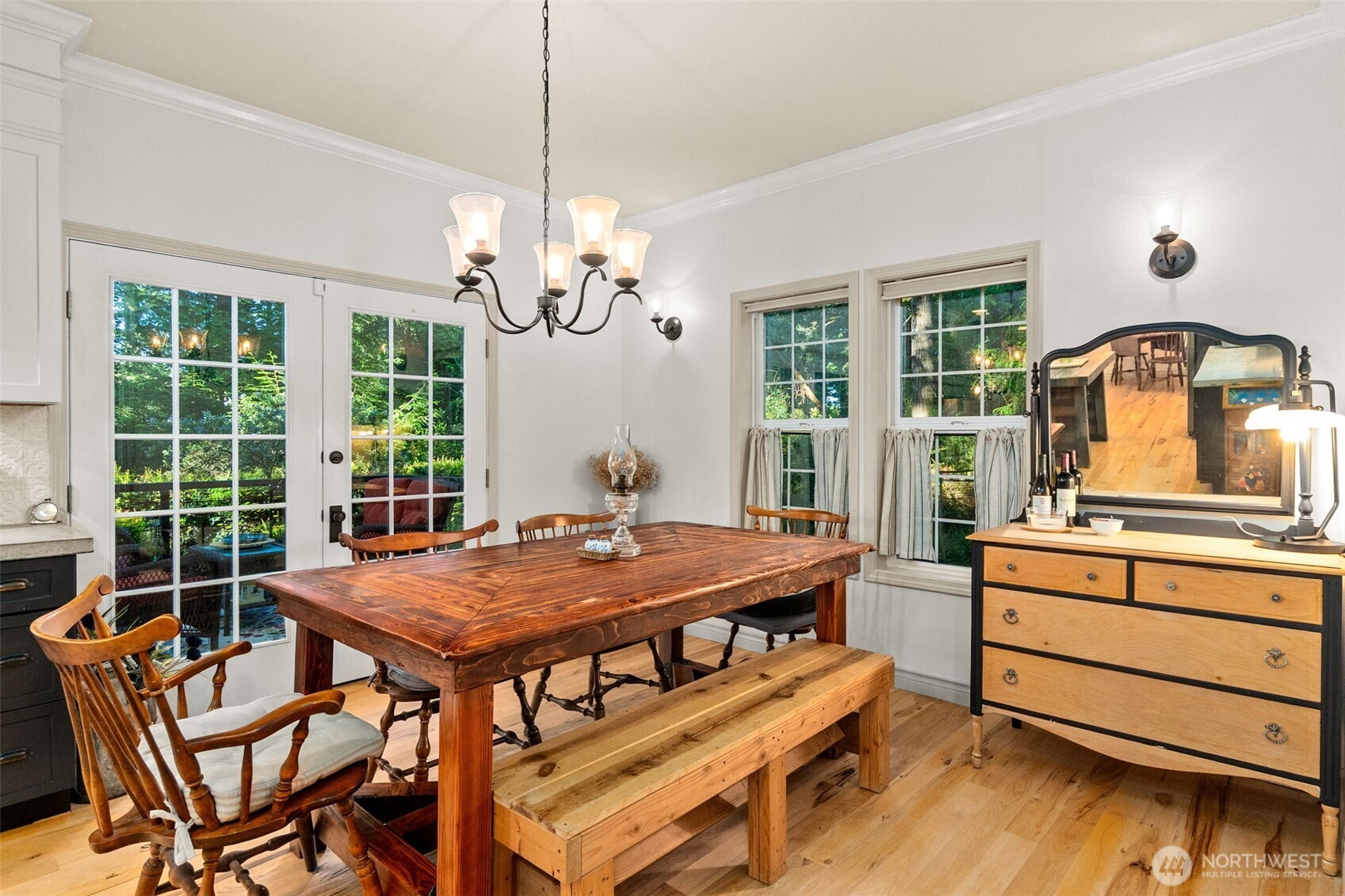 1130 East Sunset Hill Road Shelton, WA 98584 - Photo 12 of 40 a view of a dining room with furniture window and wooden floor