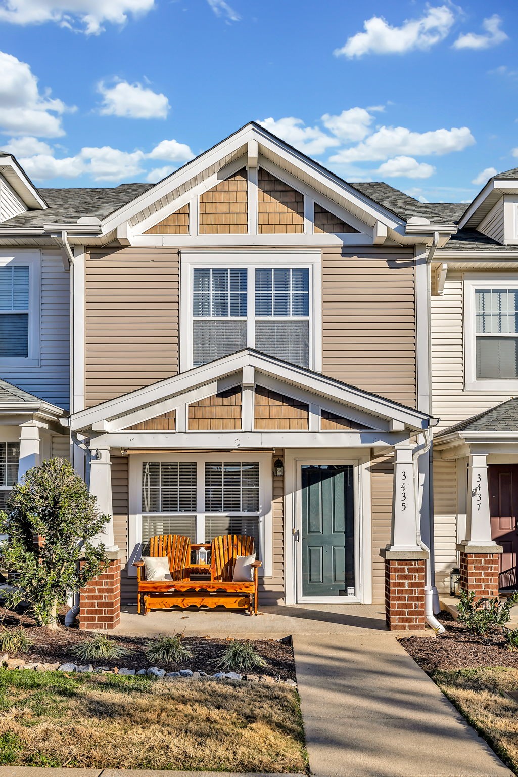 a front view of a house with a yard