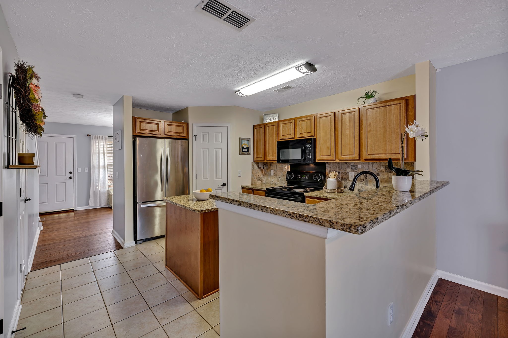 3435 Harpeth Springs Drive Nashville, TN 37221 - Photo 13 of 34 a kitchen with stainless steel appliances granite countertop a refrigerator a stove and a sink