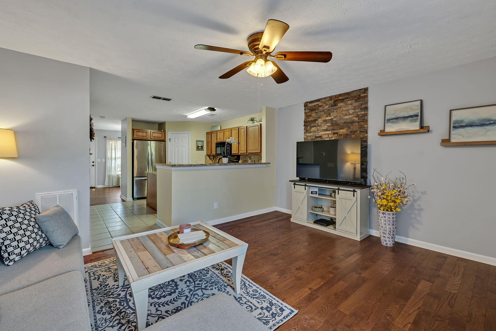 3435 Harpeth Springs Drive Nashville, TN 37221 - Photo 16 of 34 a living room with furniture and a flat screen tv