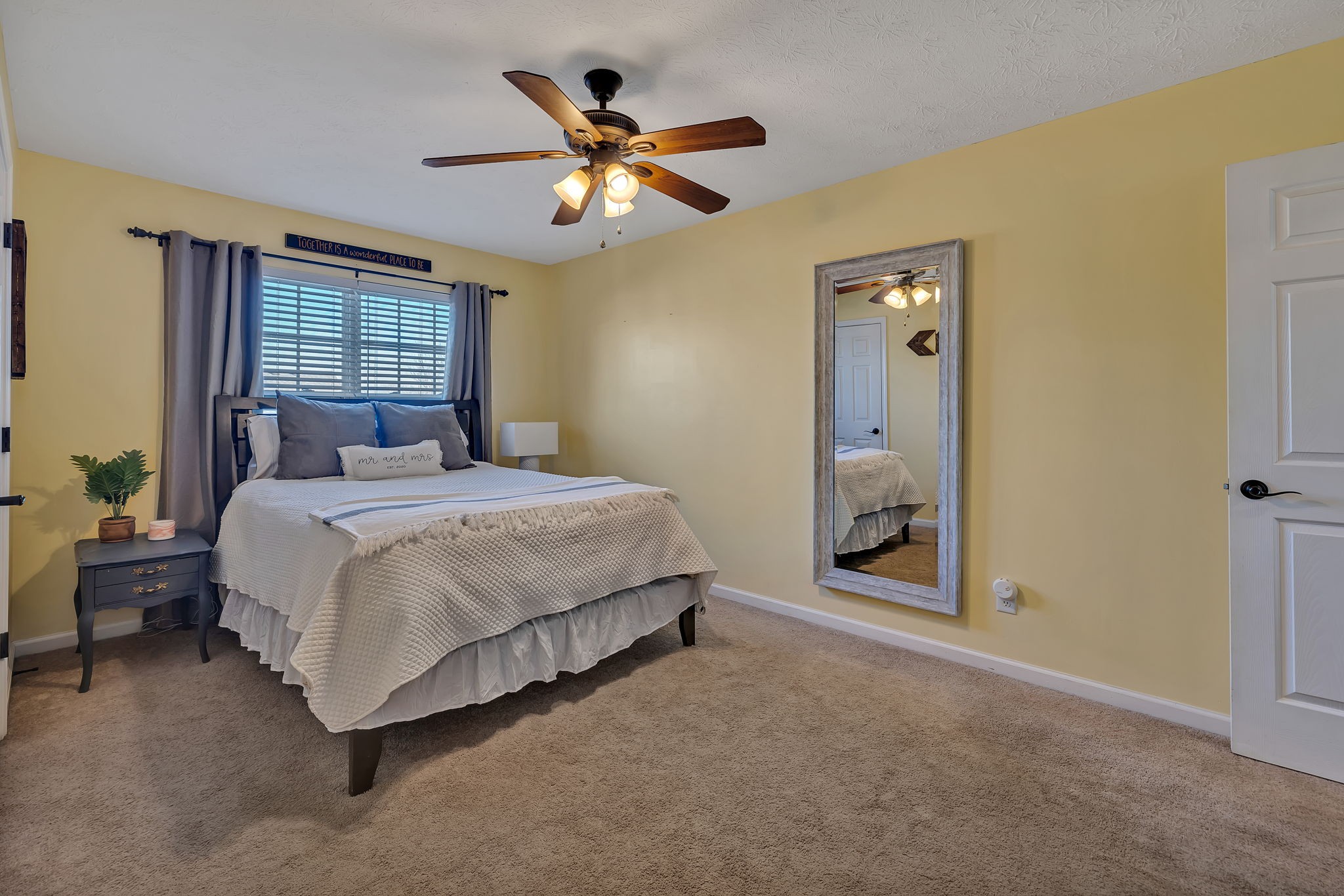 3435 Harpeth Springs Drive Nashville, TN 37221 - Photo 20 of 34 a bedroom with a bed and a chandelier