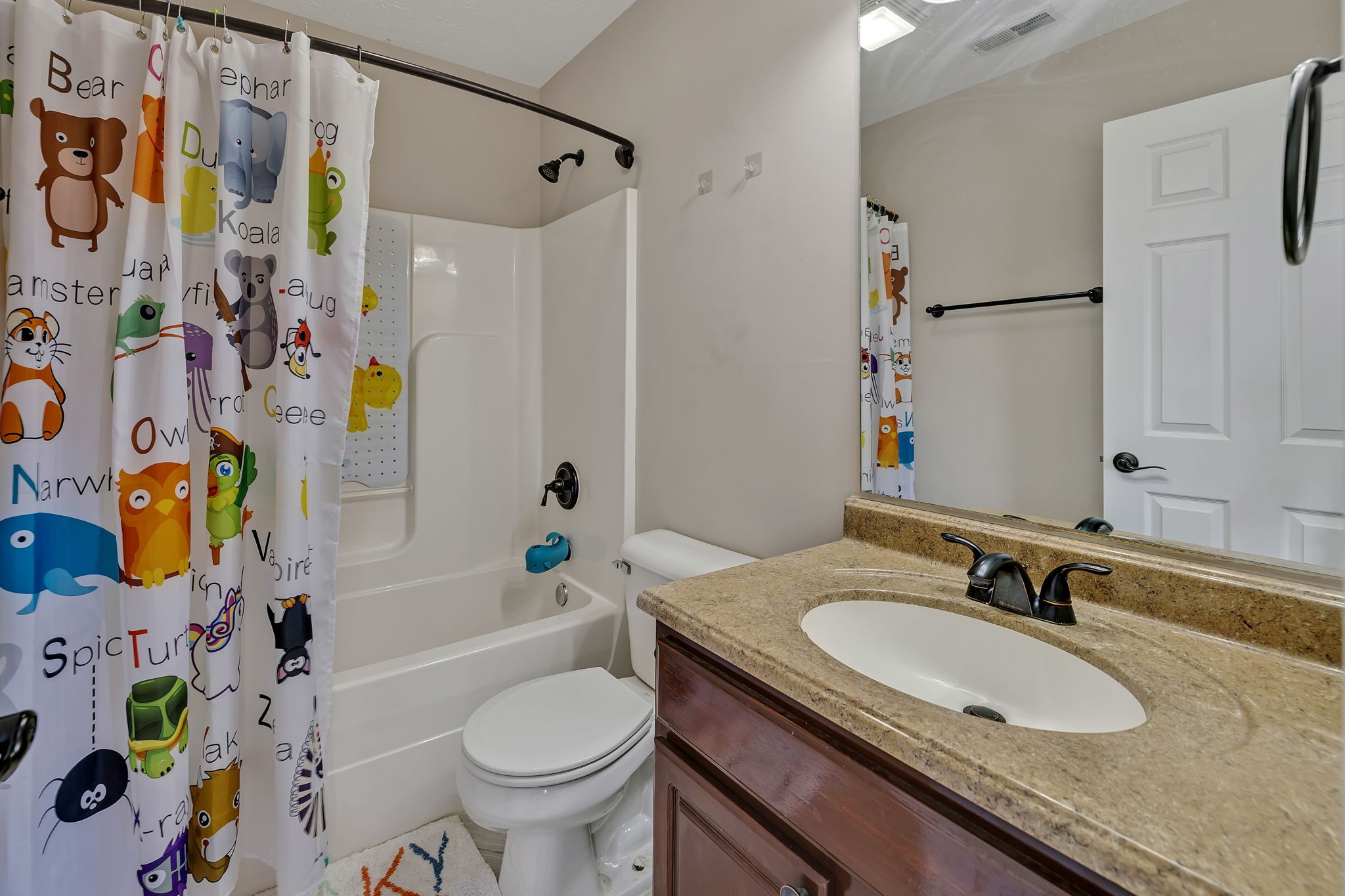3435 Harpeth Springs Drive Nashville, TN 37221 - Photo 25 of 34 a bathroom with a granite countertop sink and a mirror