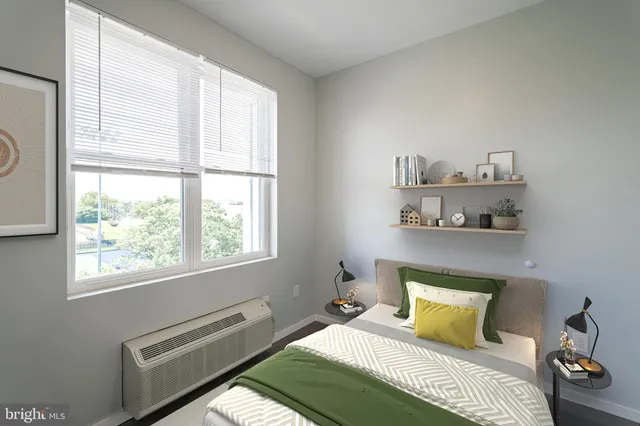 a bedroom with a bed and a window