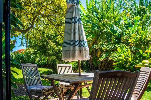 a view of balcony with wooden floor and outdoor seating