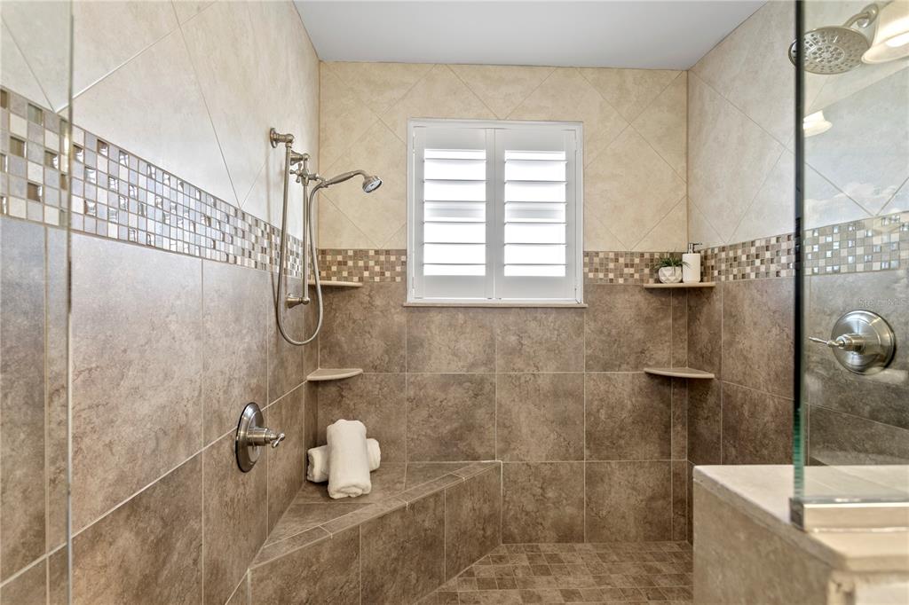 19730 Gulf Boulevard, Unit 400 Indian Rocks Beach, FL 33785 - Photo 68 of 90 a bathroom with a shower